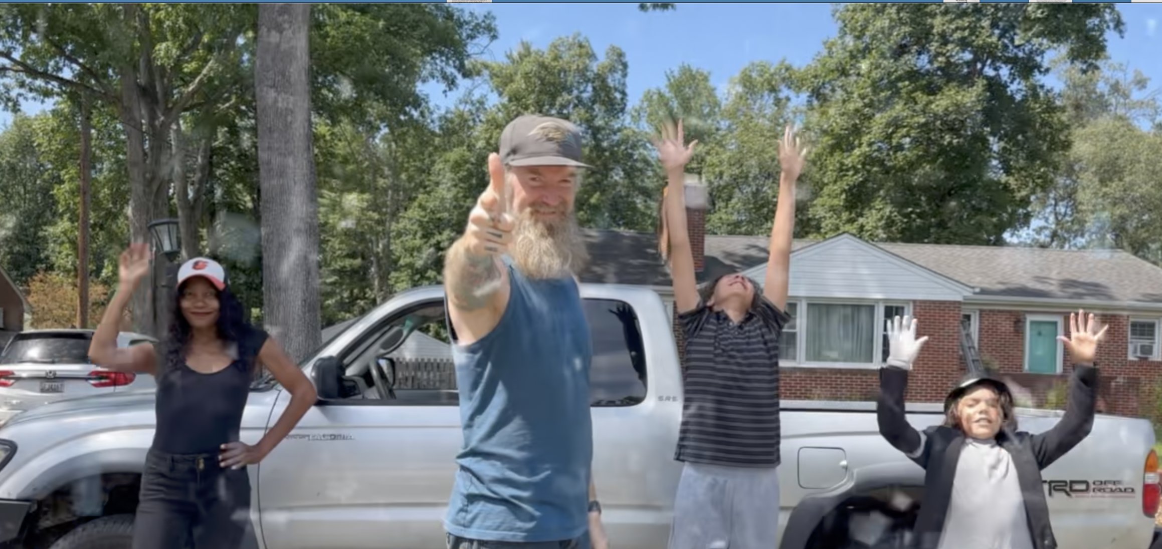 JC and a happy family celebrating after a junk removal job